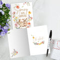 Load image into Gallery viewer, The inside of Tree-Free’s Spring Has Sprung card, with the cover and envelope in the background.

