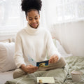 Load image into Gallery viewer, Lifestyle image(s) featuring Tree-Free’s Lotus Yoga Chick card
