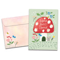 Load image into Gallery viewer, Cover of Mushroom House New Home card (featuring script text above artwork of a mouse unlocking the door of a mushroom house surrounded by flowers) and its matching envelope
