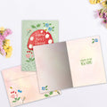 Load image into Gallery viewer, The inside of Tree-Free’s Mushroom House card, with the cover and envelope in the background.
