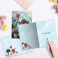 Load image into Gallery viewer, The inside of Tree-Free’s Surrounding with Love card, with the cover and envelope in the background.
