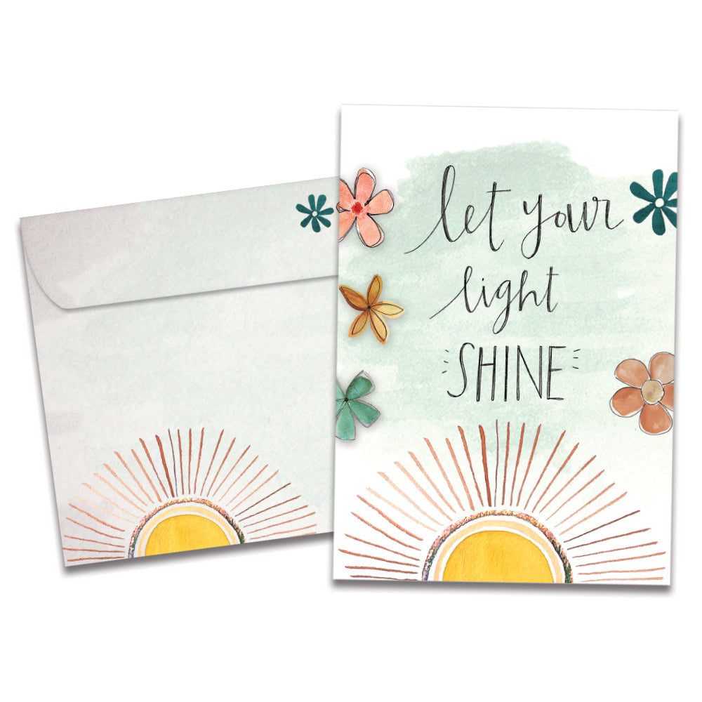 The cover of Tree-Free's Let Your Light Shine card, along with its matching envelope.