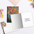 Load image into Gallery viewer, The inside of Tree-Free’s Shimmering Wishes card, with the cover and envelope in the background.
