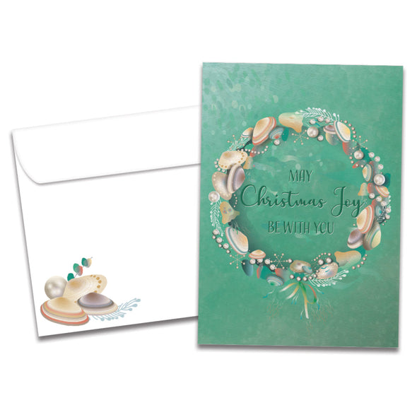 The cover of Tree-Free's Seashell Joy card, along with its matching envelope.