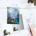 Load image into Gallery viewer, The inside of Tree-Free’s And They Danced card, with the cover and envelope in the background.
