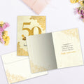 Load image into Gallery viewer, The inside of Tree-Free’s 50 Golden Years card, with the cover and envelope in the background.
