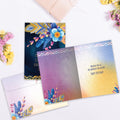 Load image into Gallery viewer, The inside of Tree-Free’s Warm Kind Gentle card, with the cover and envelope in the background.
