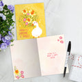Load image into Gallery viewer, The inside of Tree-Free’s Sunshine and Smiles card, with the cover and envelope in the background.
