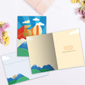 Load image into Gallery viewer, The inside of Tree-Free’s Next Leg 50 card, with the cover and envelope in the background.
