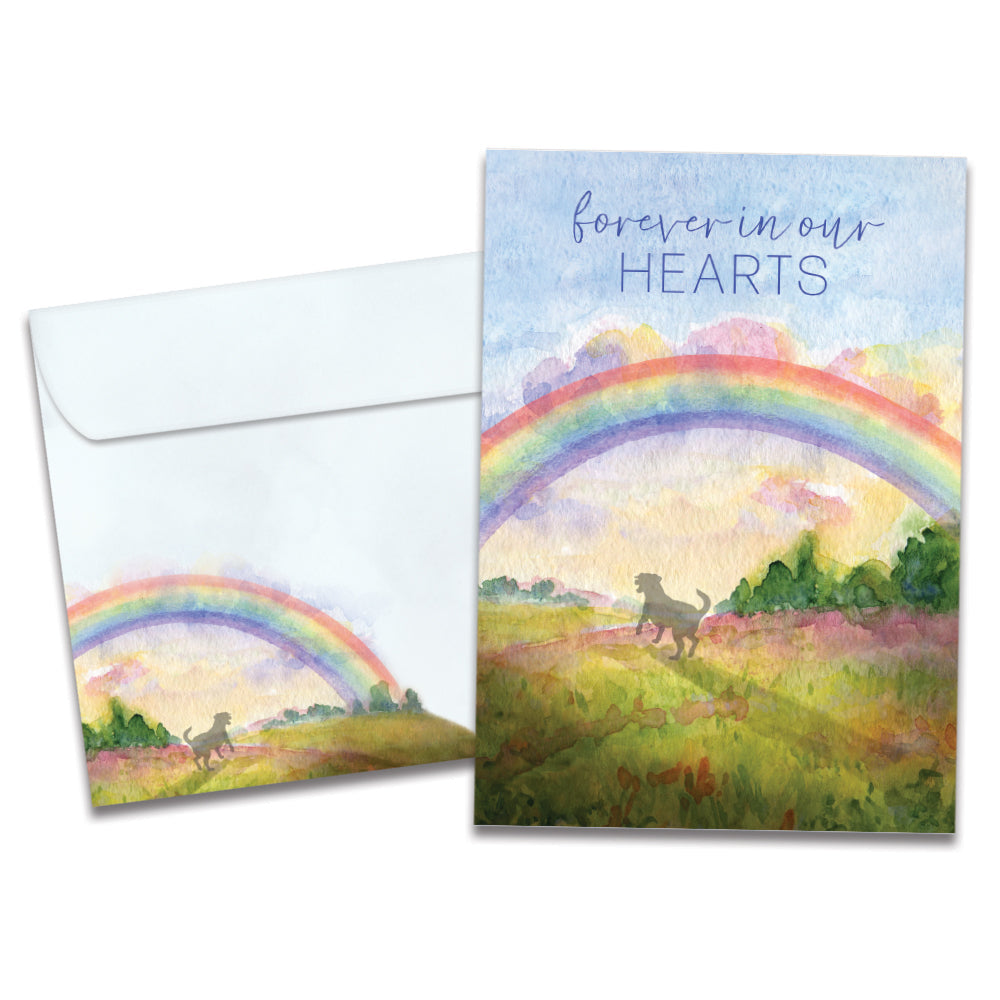The cover of Tree-Free's Sweet Dog Rainbow card, along with its matching envelope.
