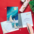 Load image into Gallery viewer, The inside of Tree-Free’s Polar Bear Wonder card, with the cover and envelope in the background.
