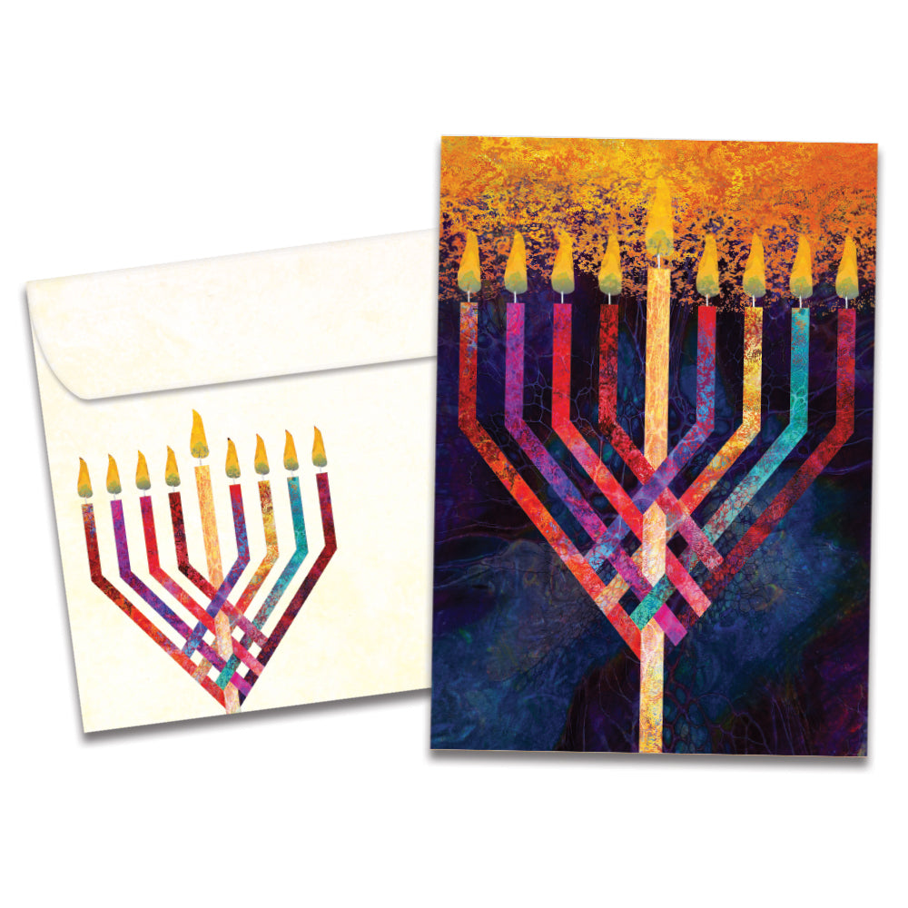 The cover of Tree-Free's Menorah Glow card, along with its matching envelope.
