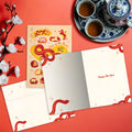 Load image into Gallery viewer, The inside of Tree-Free’s Year of Animals card, with the cover and envelope in the background.
