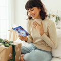 Load image into Gallery viewer, Lifestyle image(s) featuring Tree-Free’s Soaring Santa card

