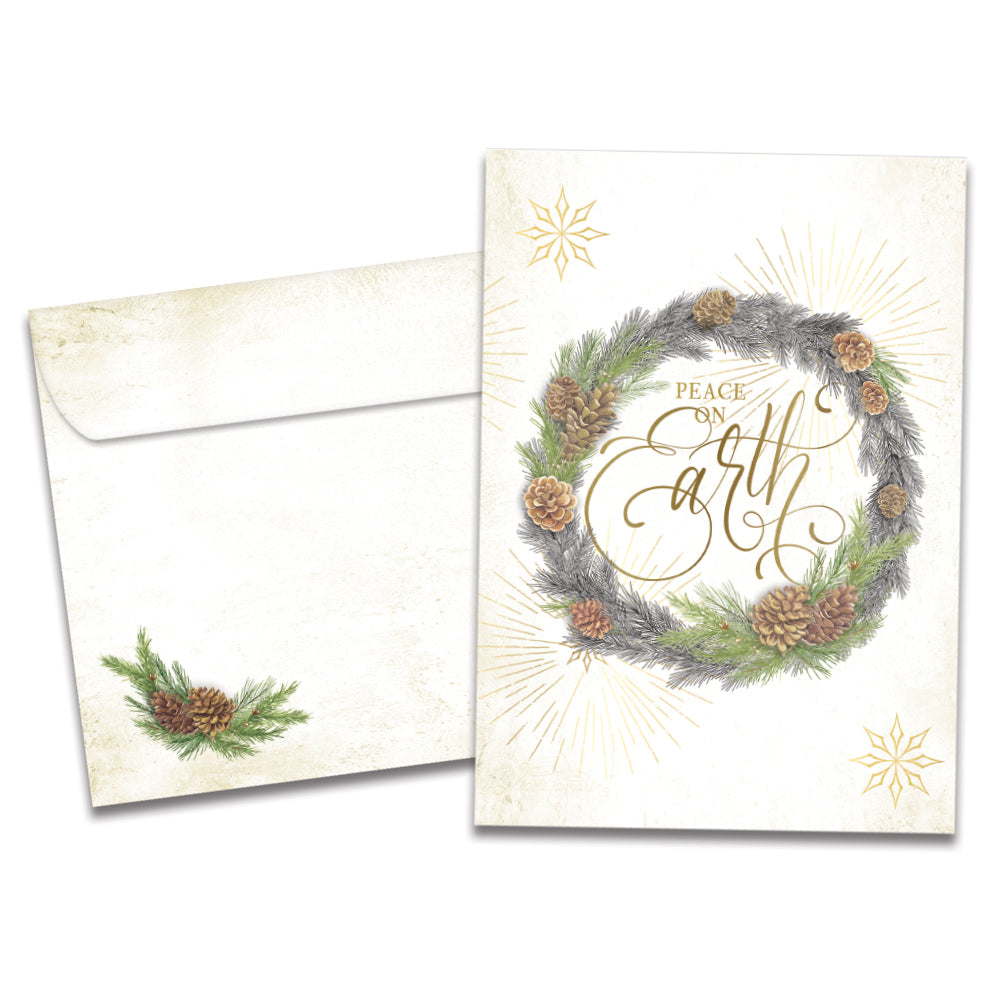 The cover of Tree-Free's Winter Pine Wreath card, along with its matching envelope.