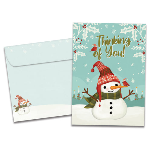The cover of Tree-Free's Merry Snowman card, along with its matching envelope.