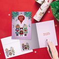 Load image into Gallery viewer, The inside of Tree-Free’s Cat Carolers card, with the cover and envelope in the background.
