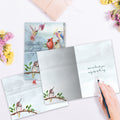 Load image into Gallery viewer, The inside of Tree-Free’s Hummingbird Journey card, with the cover and envelope in the background.
