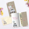Load image into Gallery viewer, The inside of Tree-Free’s Just Married card, with the cover and envelope in the background.
