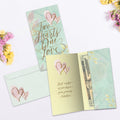 Load image into Gallery viewer, The inside of Tree-Free’s Two Hearts card, with the cover and envelope in the background.

