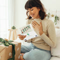 Load image into Gallery viewer, Lifestyle image(s) featuring Tree-Free’s Merry Little Christmas Drawn card
