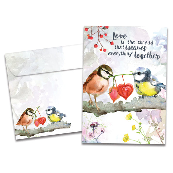 The cover of Tree-Free's Threads of Love card, along with its matching envelope.