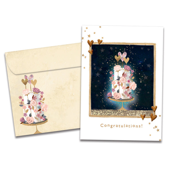 Cover of Love and Happiness Wedding card (featuring serif text below artwork of a cake on a stand surrounded by flowers, hearts, and stars) and its matching envelope