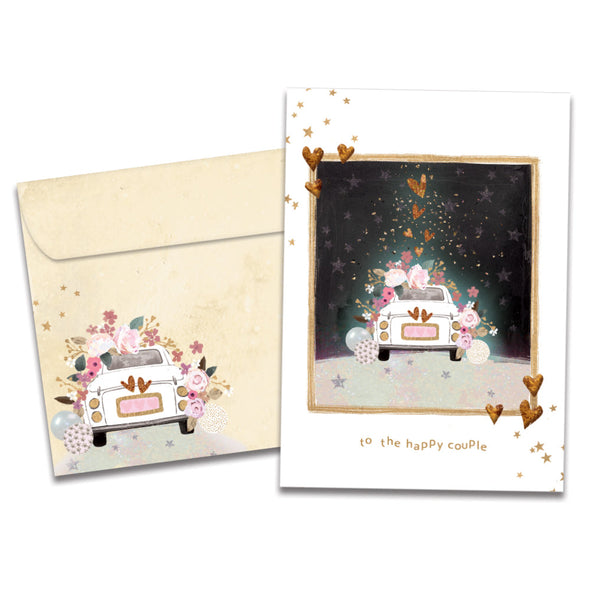 Cover of Wonderful Journey Wedding card (featuring serif text below artwork of a car surrounded by balloons, flowers, hearts, and stars) and its matching envelope